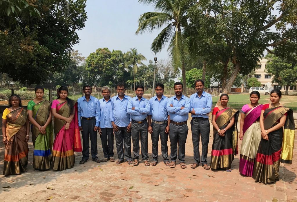 Tribe Rising India teachers and staff standing together outside the school