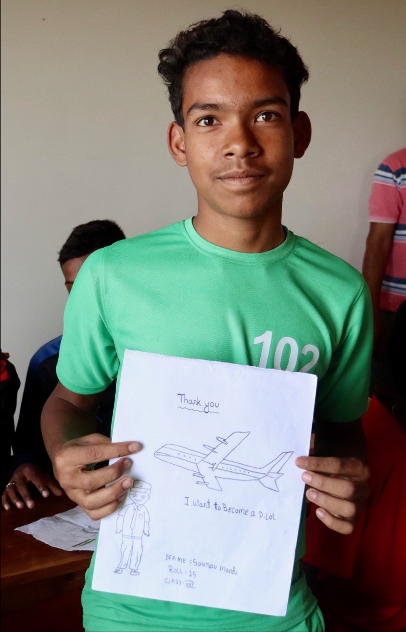 Sourav holding his airplane drawing